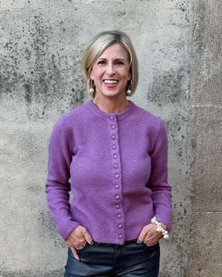 blonde woman in a purple sweater