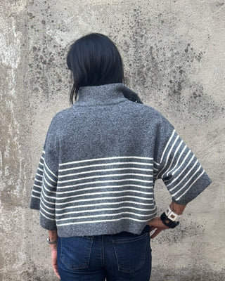 woman in grey striped 3/4 sleeve sweater