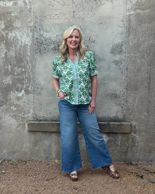 woman in a Jodifl Green damask top with Kut from the Kloth Kelsey jeans 