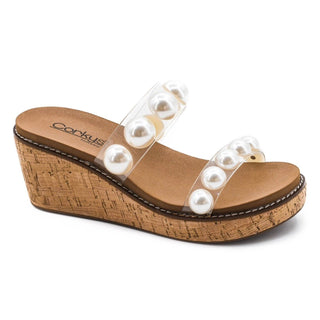 Wedge sandal with pearl embellishments on a white background