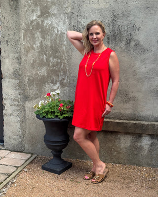 woman in a sleeveless red dres