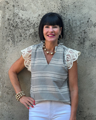 woman in a lace sleeve top