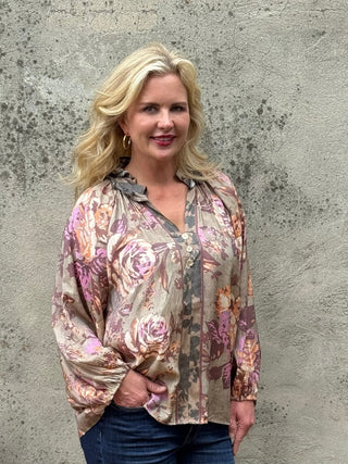 Umgee olive floral ruffle collar blouse with balloon sleeves and gold buttons, styled with dark wash jeans