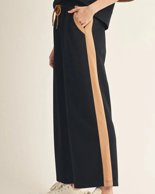 Black wide leg pant with camel side stripe and drawstring waist by Jodifl