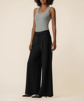 Kut from the Kloth Cheryl high rise black ponte wide leg pant with front pleats styled with a gray tank and black pointed heels