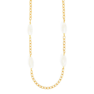 Gold chain necklace with white beads on a white background