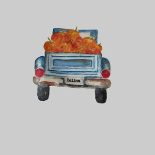 Fabric with a truck and pumpkin design on a white background