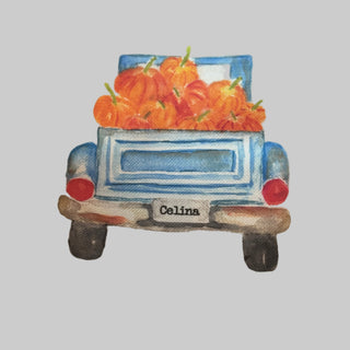 Towel with a blue truck and pumpkins design, featuring the brand 'Celina'.