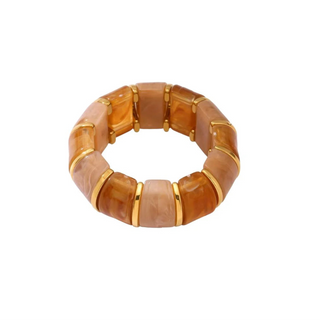 Bracelet with brown and gold stones on a white background